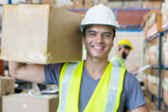 man in warehouse holding a box